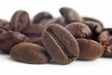 Coffee beans close up in isolated white background