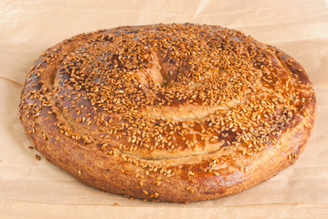 muffin on a with sesame oil and sesame.