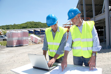 Industrial people working on building site