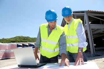 Industrial people working on building site