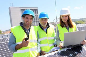 Group of engineers meeting on building roof