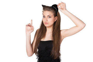 Portrait of young female in black dress and pussycat ears