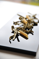 Italian pasta, penne and spinach tagliatelle