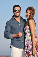 happy young couple have romantic time on beach