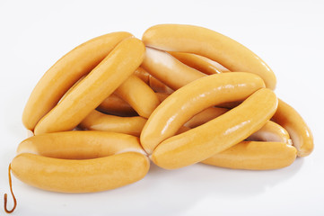 pile raw sausage on white background