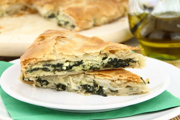 Homemade puff spinach pie with filo pastry
