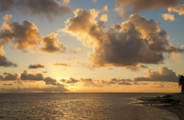 Cloudscape over Ocean and Island at Sunset