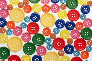 Buttons in bright colors on white full frame view