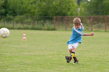 Little Boy playing soccer