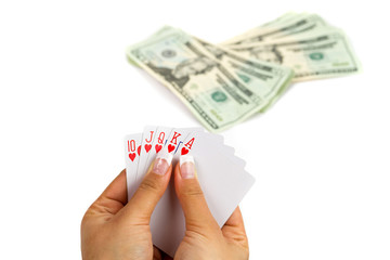 Royal poker in female hand with money background