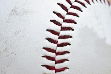 Fototapeta na wymiar Close up macro of used baseball stitching