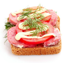 tomatoes and sausage on bread isolated on white