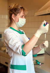 Young medical sister makes the laboratory analysis