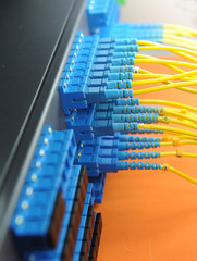 shot of network cables and servers in a technology data center