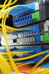 shot of network cables and servers in a technology data center