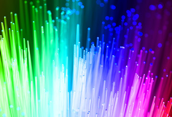 Fiber optics background with lots of light spots .