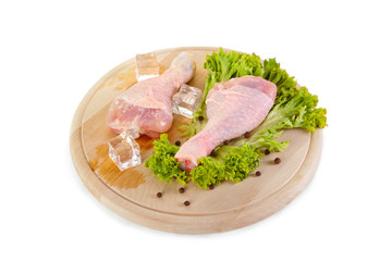Fresh and frozen chicken legs with green salad