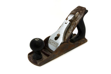 Old rusty wood plane over white
