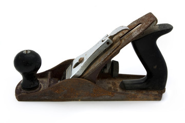 Old rusty wood plane over white