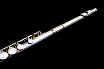 Silver flute on a black background © andrewprosser