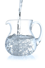 Stream of water falling in jug