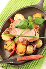 Roasted pork chop and potatoes