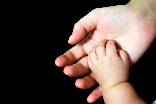 baby hand in mother's palm