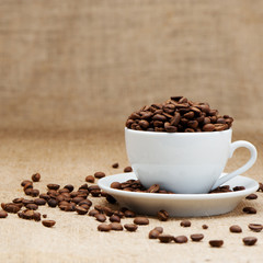 White cup with coffee grains