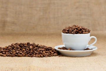 White cup with coffee grains