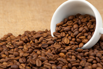 White cup with coffee grains