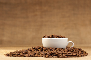 White cup with coffee grains