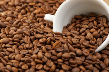 White cup with coffee grains