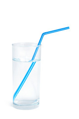 Water glass with a blue straw