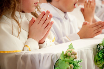 children accepting the first Holy Communion