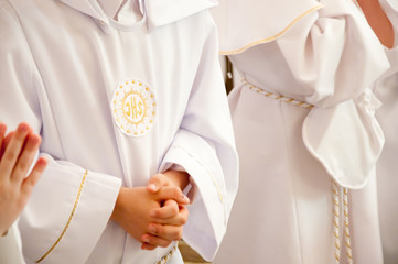 children accepting the first Holy Communion