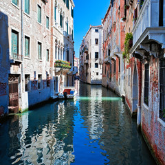 Fototapeta na wymiar View of colored venice canal with houses in water, Italy