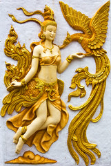 Stucco walls Kinnaree golden birds swan.