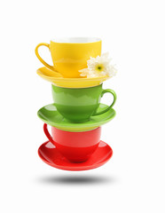 Three different colored cups