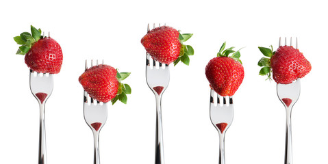 forks with strawberry, isolated on white