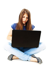 Naklejka premium Attractive teenage girl using notebook computer