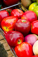 Red apples in the basket of fruit.