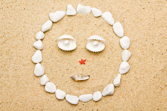 smile of shells on the sand. funny smile