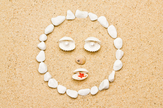 smile of shells on the sand. funny smile