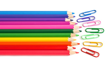 Colored crayons and paper clips, office stationery