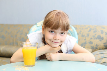 portrait of little girl with orange juice