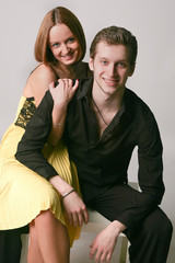 Young couple on a gray background