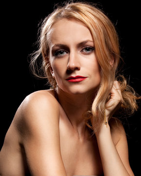 Fashion portrait of sensual young woman on black background