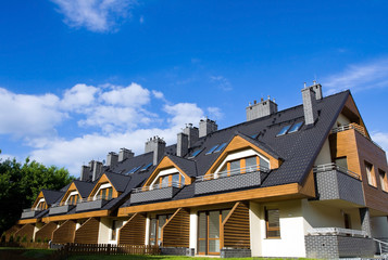New Homes over blue cloudy sky