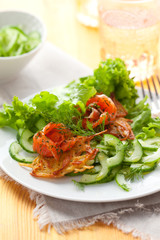 Potato rosti with smoked salmon and cucumber salad