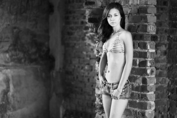 Young woman posing over old building
